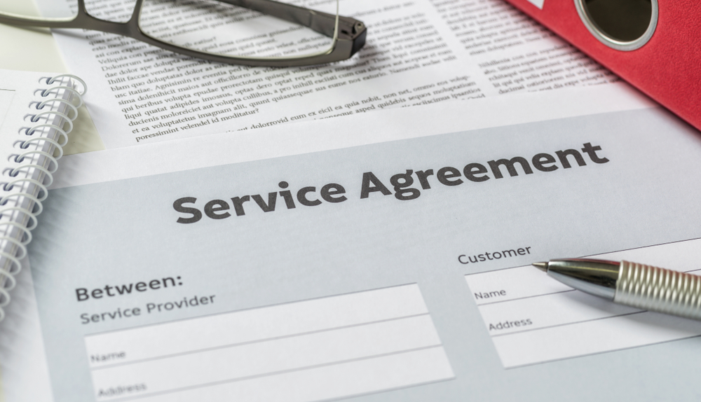 Service agreement on paper with a pen